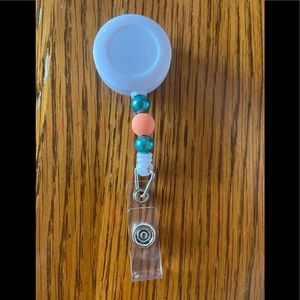 Custom Peach and Teal Pearl Interchangeable Badge Reel.